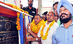 BJP MLA Manoranjan Kalia lays the foundation stone of a road in Baba Budhaji Nagar, Ward No. 13, in Jalandhar on Sunday