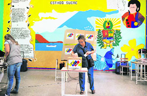 Women vote at a polling station in Caracas on Sunday.