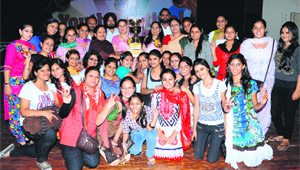 Members of the team of the BBK DAV College for Women pose with the overall championship trophy they won at the 'A' Zone Youth Festival of Guru Nanak Dev University in Amritsar on Monday. 