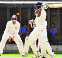 A batsman plays a shot during a match between Kerala and Madhya Pradesh Cricket Association at the PCA Stadium in Mohali on Monday. Tribune photo: vicky gharu