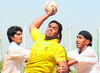 Manavpreet Singh Bawa of Guru Gobind Singh College on way to score a goal against SGGS Khalsa, Mahilpur, during the inter-college handball competition held at Panjab University on Monday. Tribune photo: pradeep tewari