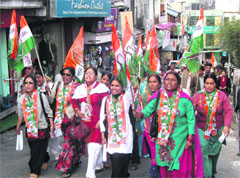 Women workers of the Congress take out a rally in Mussoorie on Monday.