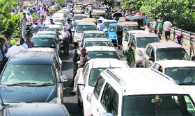 A traffic jam caused due to the protest in Ludhiana on Monday.