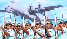 IAF personnel raise their rifles in salute during the Air Force Day parade to mark its 80th anniversary at Hindon Air Force Station on Monday