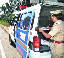 A policeman issues a challan for overspeeding on the Sangrur Road in Patiala on Monday. 
