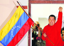 Venezuelan President Hugo Chavez waves the national flag from a balcony at Miraflores Palace in Caracas. 