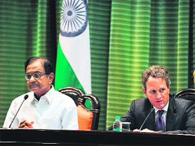 Finance Minister P. Chidambaram (L) watches as US Treasury Secretary Timothy Geithner addresses a joint press conference after a meeting in New Delhi on Tuesday. Geithner is on a two-day visit to India 