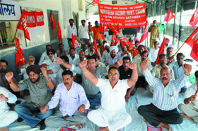 Railway employees staging a protest seeking acceptance of their long-pending demands, at the Platform No. 6 of Bathinda railway station on Tuesday.