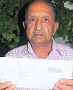 DK Syal shows the letter which was returned to him