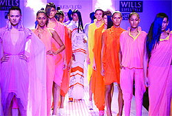 Models present the creations of designer Gaurav Gupta during the Wills India Fashion Week 2013 at Pragati Maidan in New Delhi Tuesday