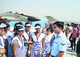 Students of Sugni Devi Arya Girls Senior Secondary School, Ladwa, interact with an IAF officer at the Hindon Air Force station