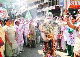 INLD womens wing workers burn an effigy of Chief Minister Bhupinder Singh Hooda at Kurukshetra on Tuesday in protest against rape incidents across the state
