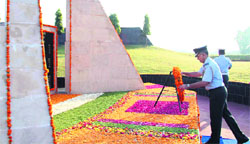 Air Commodore M Fernandez lays a wreath at the Station War Memorial in Air Force station in Adampur on Monday. A tribune photograph