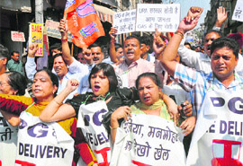 Activists of the BJP protest against the UPA government at City Chowk in Jammu on Tuesday. 