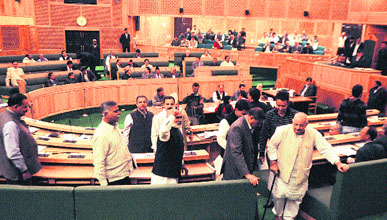BJP and Panthers Party MLAs stage a walkout from the Assembly over the panchayat issue in Srinagar on Tuesday.