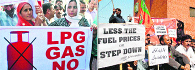 Panthers Party and BJP activists protest against restrictions on sale of subsidised LPG in Srinagar on Tuesday. 