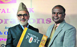 Ali Mohammad Sagar, Minister for Rural Development, Law, Justice and Parliamentary Affairs, along with John Samuel, Chief Post Master General J&K Circle,  during a function to mark the Postal Week  Celebration  at GPO in Srinagar. 