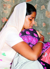 The Jind victims mother is consoled by a relative at the family home on Tuesday.