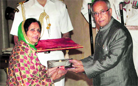 President Pranab Mukherjee presents Akademi award to singer Gurmeet Bawa of Punjab at Rashtrapati Bhavan in New Delhi on Tuesday.
