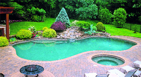 Flowering shrubs near the pool provide visual relief