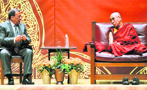 The Dalai Lama listens to Andrew Young during a symposium on The Rise of Democracy in the Middle East as part of the two-day Common Ground for Peace forum in Syracuse, New York.
