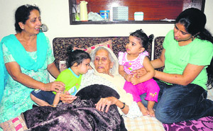 Kulwant Kaur, who will turn 100 on October 12, along with her family members, at her residence in Sector 21, Chandigarh, on Wednesday.