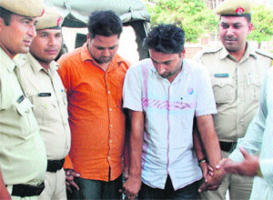 The accused in police custody at the Sector 14 police station in Panchkula on Wednesday. 