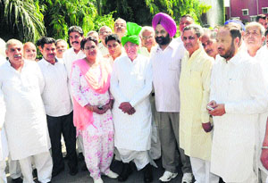 INLD MLAs led by party chief Om Prakash Chautala (centre) come out after submitting a memorandum to Governor Jagannath Pahadia in Chandigarh on Wednesday against a rapid increase in rape cases across the state. 