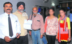 Parents of girls, who have levelled molestation charges against the owner of a private air hostess institute, come out after filing a complaint with the Police Commissioner in Jalandhar. Tribune Photo: Malkiat Singh
