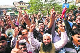 Employees hold a protest outside the Deputy Commissioners office in Srinagar on Wednesday