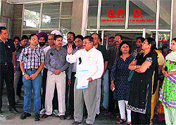 Doctors hold a protest at Lord Mahavira Civil Hospital in Ludhiana on Wednesday
