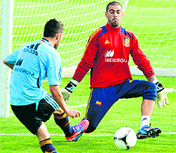 Spains David Villa trains with goalkeeper Victor Valdes near Madrid on Wednesday, ahead of their World Cup 2014 qualifiers
