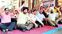 Teachers protest at DAV College in Amritsar on Thursda