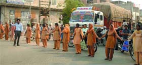 Demanding regularisation of their jobs, special trainer teachers block traffic on the main chowk in Faridkot on Thursday