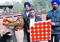 A file photo of the traffic cops installing a reflector on a tractor