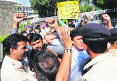 Policemen stop protesting ABVP activists from moving towards the convention venue at Panjab University in Chandigarh on Thursday.