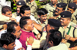BJP workers led by MLA Shahdev Pundir argue with the police