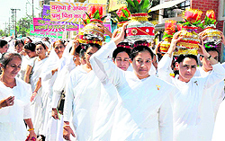 Braham Kumaris carry kalash on their heads as part of a sadhbavna rally in Haridwar on Thursday