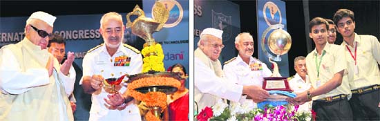 Governor Aziz Qureshi and Chief of Naval Staff Admiral DK Joshi light the ceremonial lamp at the inauguration of the cartography conference in Dehradun on Thursday; and (right) the Governor and the naval chief give away a trophy to students of St Xaviers, Patna, for winning the map quiz
