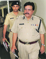 DGP RS Dalal arrives for a press conference in Chandigarh on Thursday.