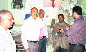 A team of the National Commission for Scheduled Castes and Scheduled Tribes talks with family members of the rape victim at Kalayat on Thursday.