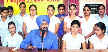 AP Singh, owner of a private air hostess training institute, addresses mediapersons in Jalandhar on Thursday. 
