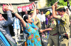 Police lathi charge activists of JK Democratic Front during the protest march at Talab Tillo area in Jammu on Thursday. 