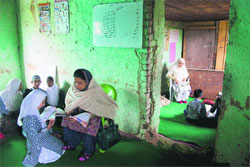 Teachers take classes in dingy classrooms at a government school in Srinagar. Photo: Yawar kabli