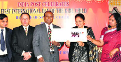 First lady Usha Vohra (centre) releases a special cover on the occasion of International day of the Girl Child in Srinagar on Thursday. Tribune photo: Amin War