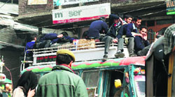 The school boys on buses roofs in Anantnag. Photo: Suhail A Shah
