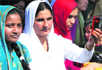 Relatives of BSF recruits during the passing out parade at Humhama on Thursday. A Tribune photograph