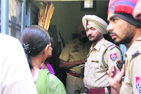 A police team records the statements of residents regarding the accidental fire case in Ludhiana on Thursday