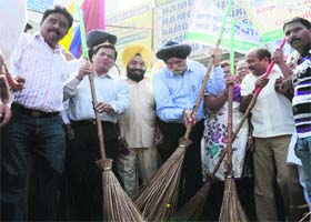 Mayor Harcharan Singh Gohalwaria (in blue shirt) launches a cleanliness drive in Ludhiana on Thursday