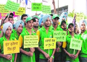 Students and volunteers carry placards to spread the message of cleanliness in Ludhiana on Thursday